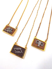 Load image into Gallery viewer, Vintage 70s Faux Gold and Wood Zodiac Charm Necklace - Aquarius, Pisces, Aries