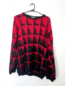 Vintage sweater in a nice red color with an allover black fading cube design.